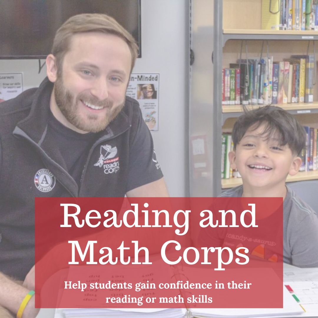 Text: Reading and Math Corps: Help students gain confidence in their reading or math skills. Photo of a man and child smiling sitting next at a classroom table. The man is wearing a black vest with an AmeriCorps and Reading Corps logo. 