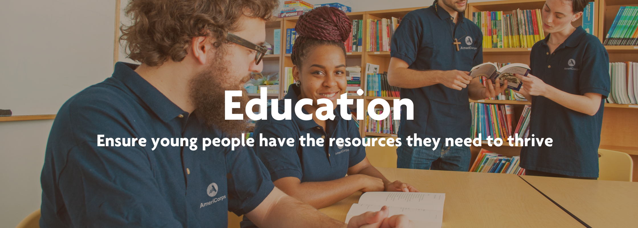  Young people in navy AmeriCorps shirts read books in a library in the background. The image reads "Education, Ensure young people have the resources they need to thrive."!